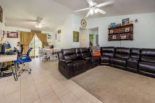 living area with lofted ceiling, ceiling fan, light tile patterned flooring, and visible vents