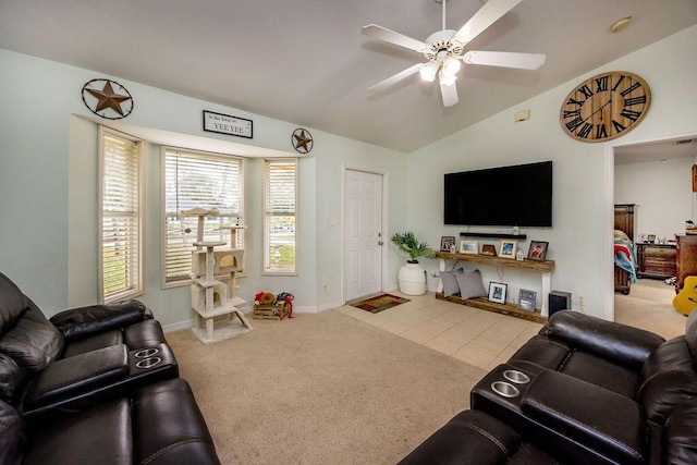 carpeted living room with a ceiling fan, tile patterned flooring, and vaulted ceiling