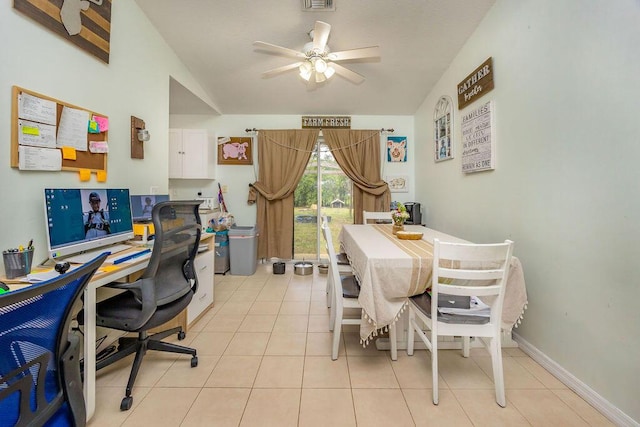 home office featuring light tile patterned floors, ceiling fan, visible vents, and baseboards