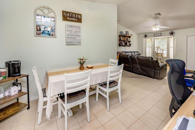 dining room featuring lofted ceiling, visible vents, ceiling fan, and light tile patterned flooring