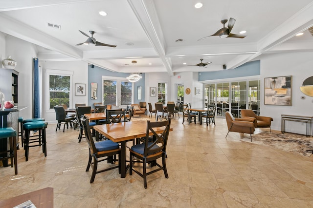 dining space with plenty of natural light, visible vents, coffered ceiling, and beamed ceiling