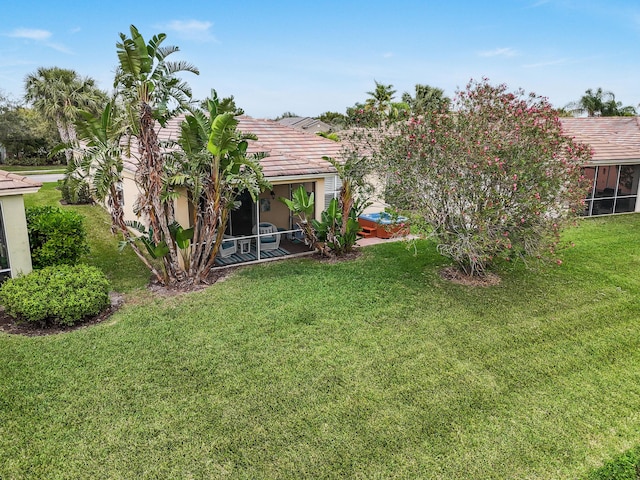 view of yard with a sunroom