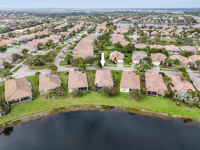 bird's eye view featuring a water view and a residential view