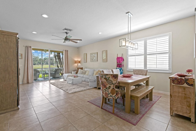 dining space with light tile patterned floors, a textured ceiling, recessed lighting, a ceiling fan, and visible vents