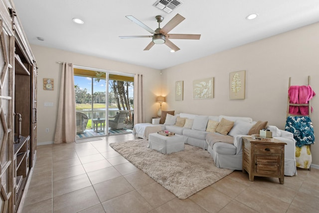 living room featuring light tile patterned floors, a barn door, visible vents, ceiling fan, and recessed lighting