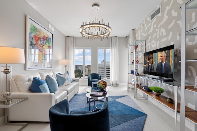 living area featuring a chandelier and visible vents