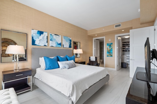 bedroom featuring visible vents and wallpapered walls