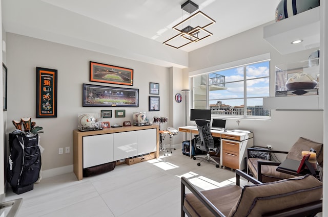 office space featuring light tile patterned floors and baseboards