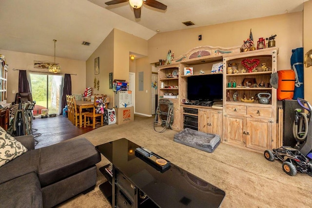 living room with lofted ceiling, carpet flooring, visible vents, and a ceiling fan