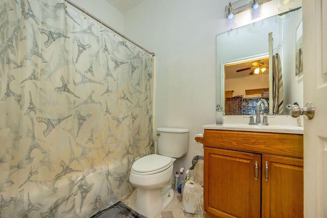 bathroom featuring a shower with curtain, toilet, a ceiling fan, vanity, and tile patterned flooring