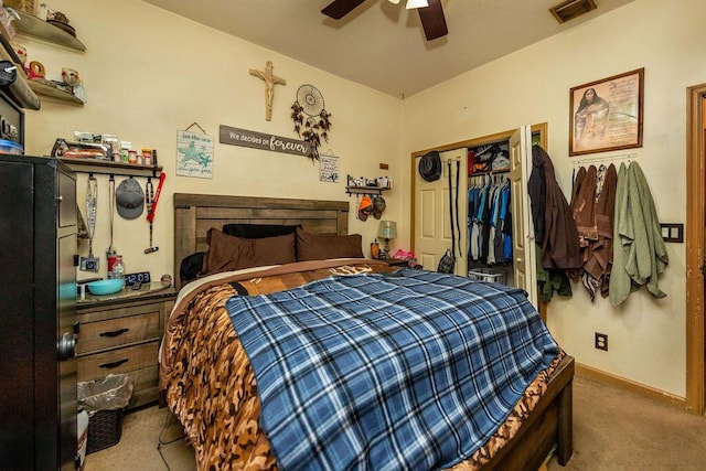 carpeted bedroom featuring a ceiling fan, a closet, visible vents, and baseboards