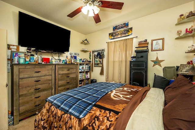 bedroom featuring light colored carpet and ceiling fan