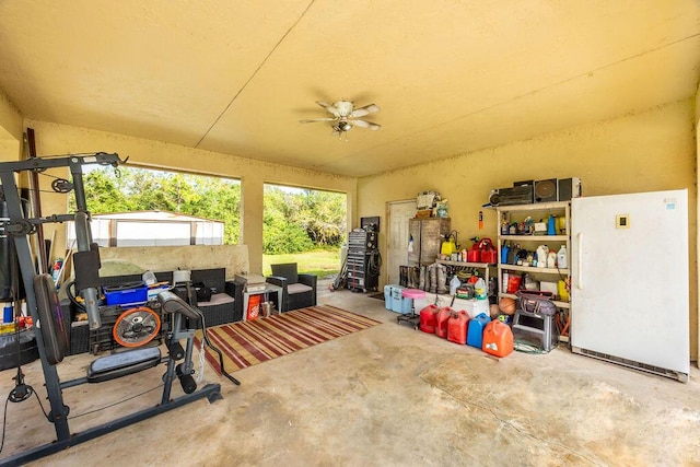 interior space featuring freestanding refrigerator and ceiling fan