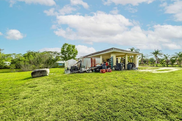 rear view of property with a yard