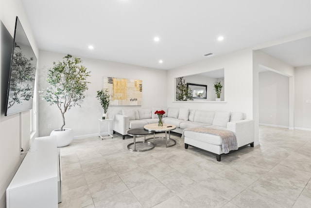 living area featuring visible vents, baseboards, and recessed lighting