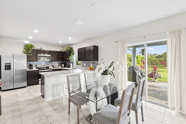 dining room featuring recessed lighting, visible vents, and light tile patterned floors