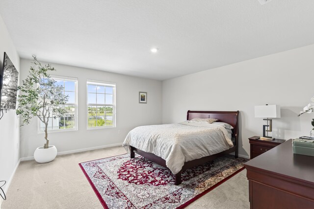 interior space featuring carpet floors, recessed lighting, visible vents, and baseboards