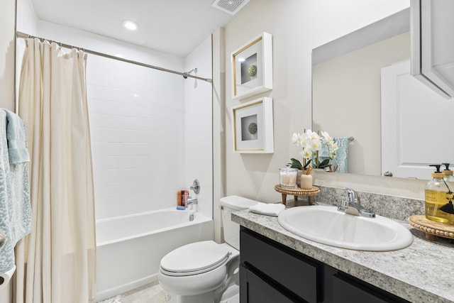 bathroom featuring shower / bath combo, visible vents, vanity, and toilet