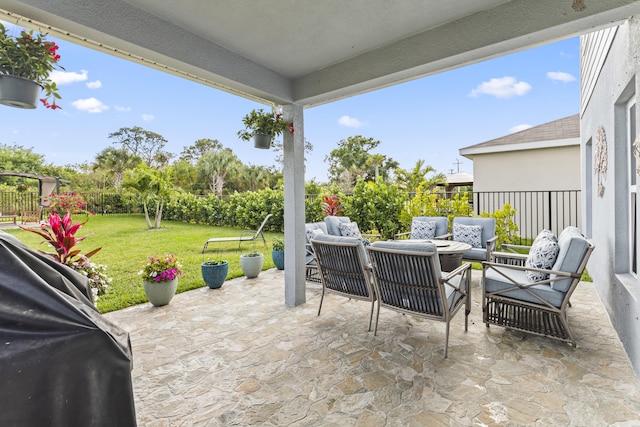 view of patio featuring grilling area, a fenced backyard, and an outdoor living space