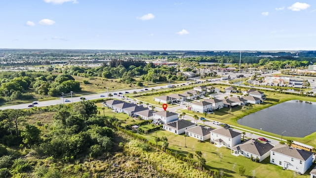 bird's eye view featuring a residential view and a water view