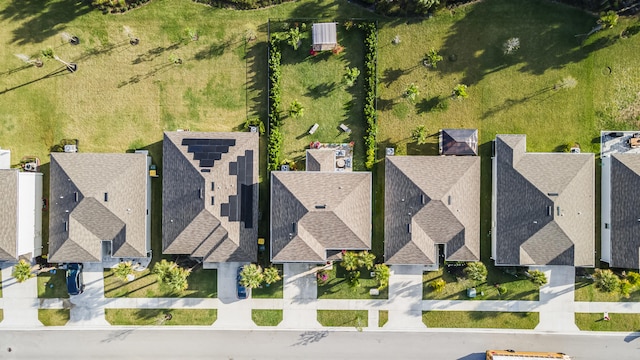 birds eye view of property with a residential view