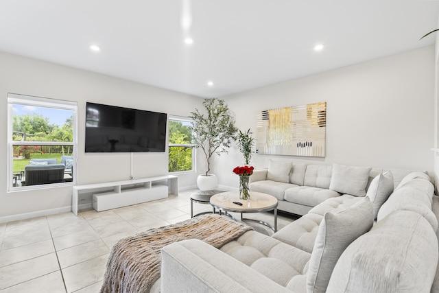 living area featuring light tile patterned floors, baseboards, and recessed lighting