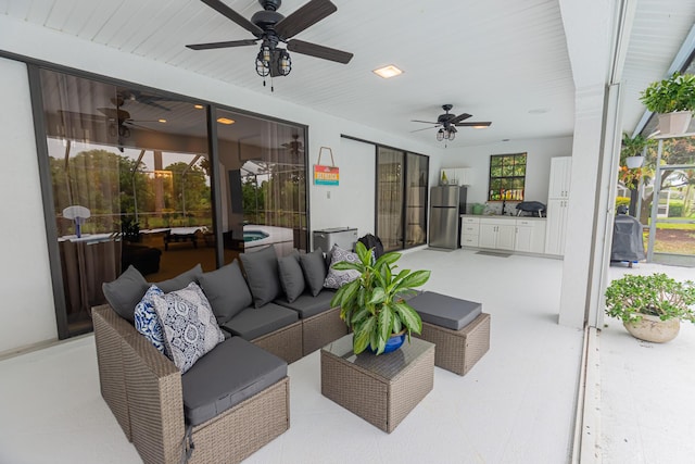 view of patio featuring an outdoor hangout area and a ceiling fan