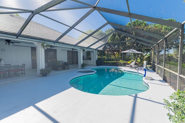 outdoor pool featuring a ceiling fan, a lanai, and a patio area