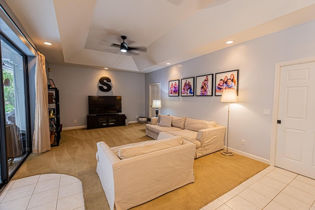 living area with baseboards, a raised ceiling, ceiling fan, carpet flooring, and recessed lighting