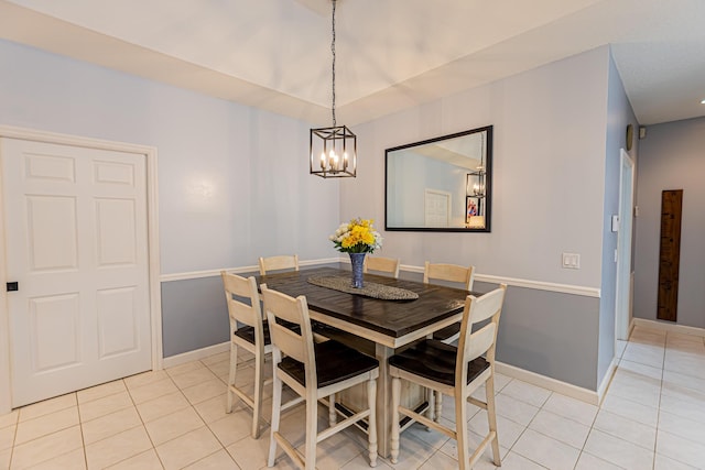 dining room featuring baseboards and light tile patterned floors