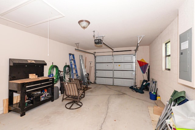 garage featuring a garage door opener and electric panel