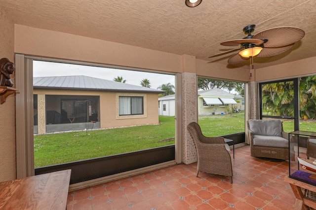 sunroom / solarium with ceiling fan