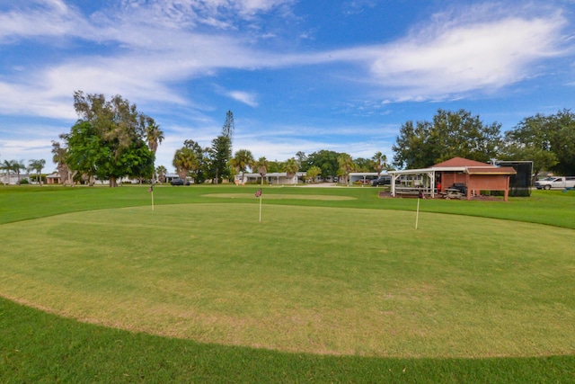 view of yard with view of golf course