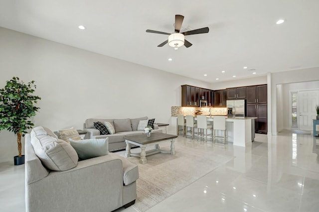 living room with recessed lighting and ceiling fan