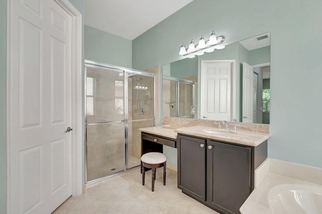 bathroom with visible vents, a stall shower, vanity, tile patterned flooring, and a bath