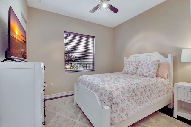 bedroom featuring a ceiling fan and baseboards