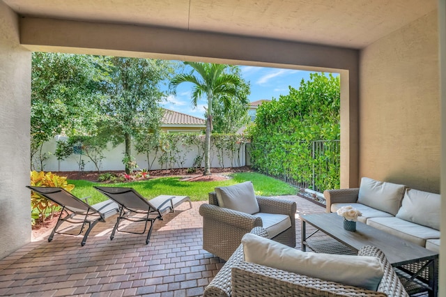 view of patio / terrace featuring outdoor lounge area and a fenced backyard