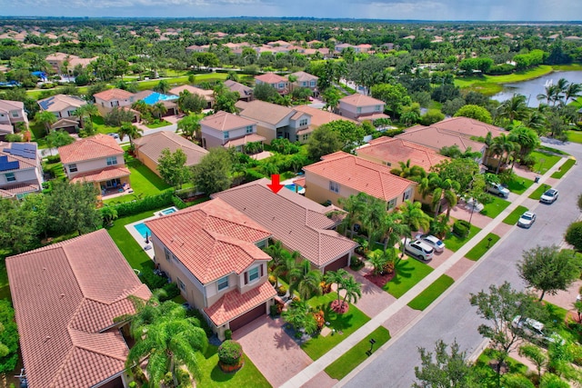 bird's eye view featuring a water view and a residential view