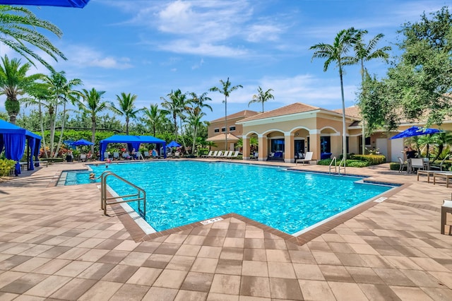 community pool with a patio area