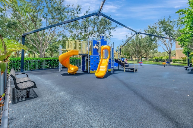 community jungle gym featuring fence