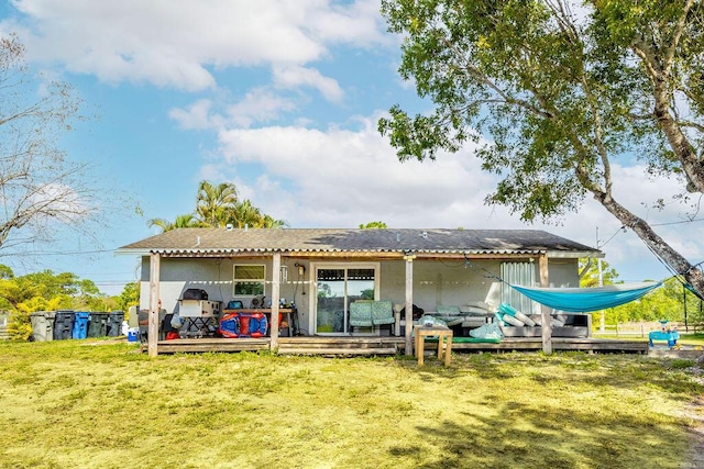 rear view of property with a yard, a wooden deck, and a pergola