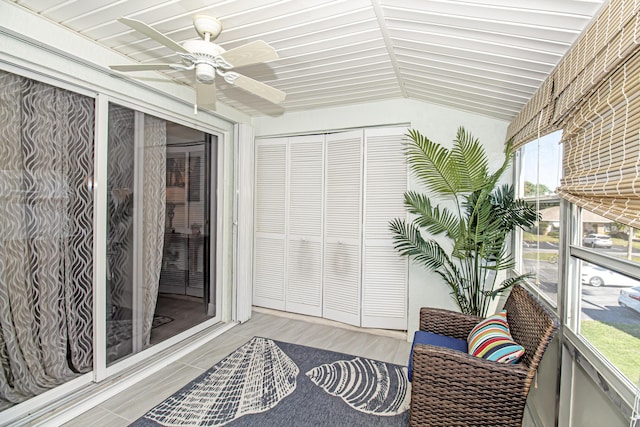 sunroom / solarium featuring ceiling fan