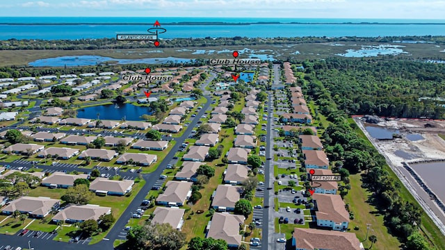 birds eye view of property featuring a water view and a residential view