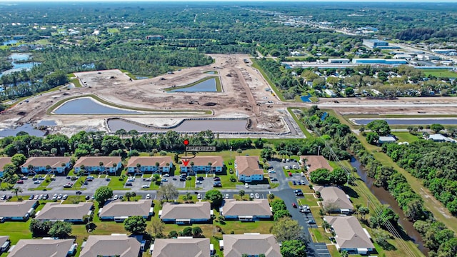 birds eye view of property with a residential view