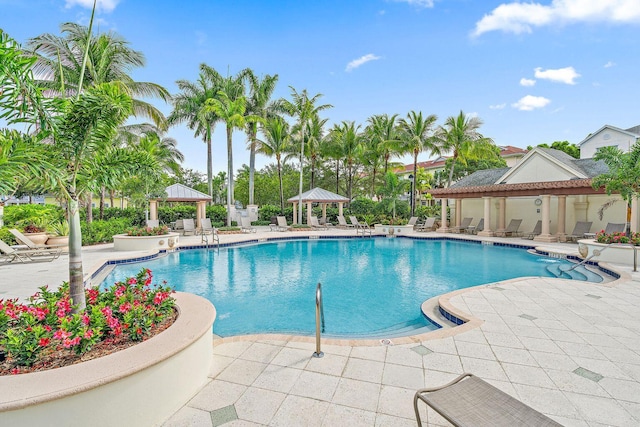 community pool featuring a gazebo and a patio