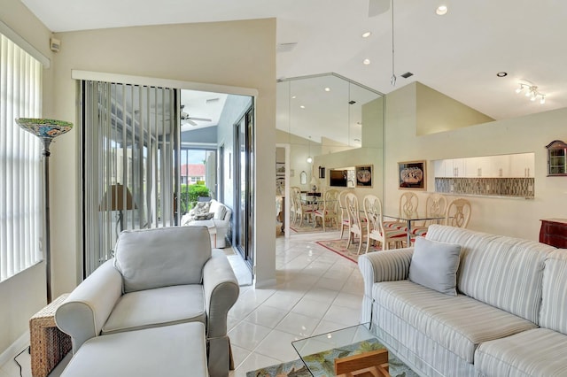 living room with recessed lighting, visible vents, a ceiling fan, light tile patterned flooring, and high vaulted ceiling