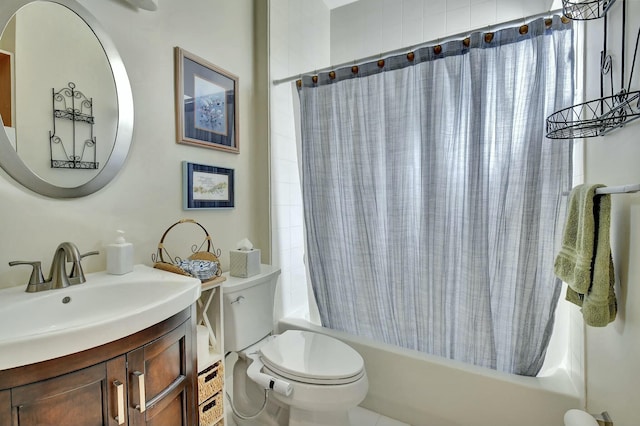 full bathroom with shower / tub combo, vanity, and toilet