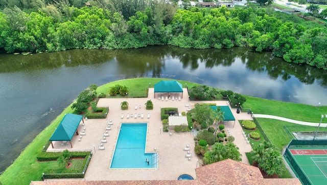 birds eye view of property with a water view