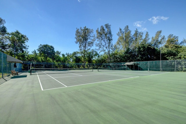 view of sport court with fence