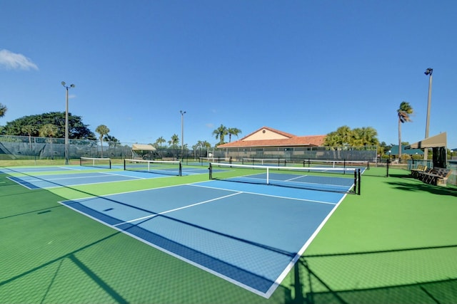 view of sport court featuring community basketball court and fence